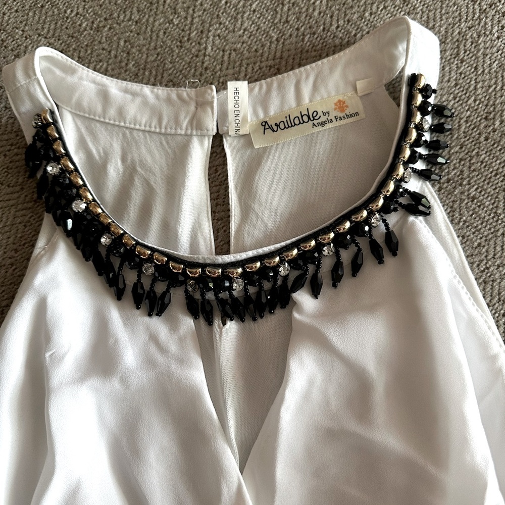 White beaded fit and flare dress. Size medium. Not see-through. Flowy and cute